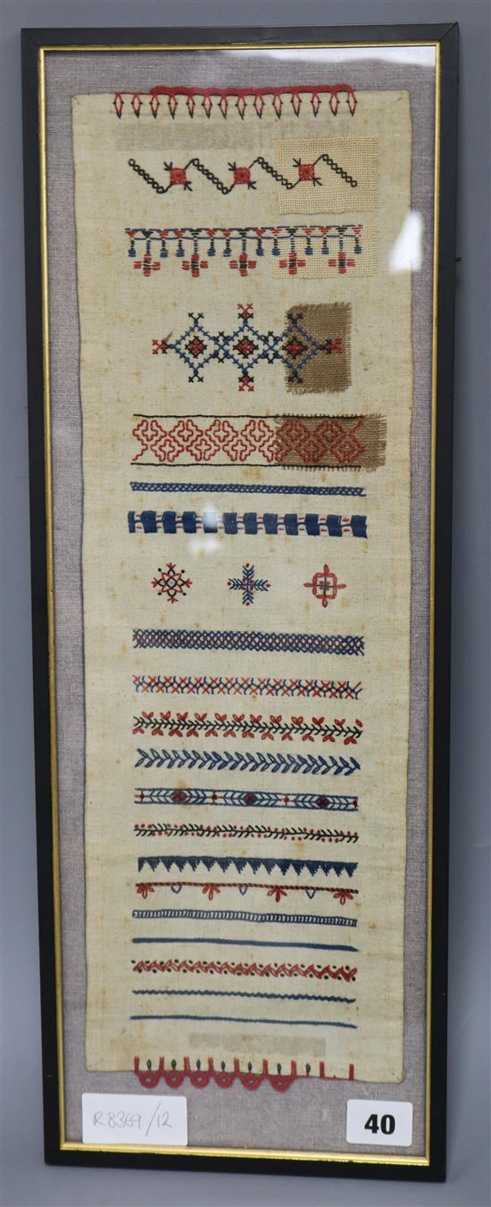 A 19th century Scandinavian sampler, framed, overall length 53.5cm